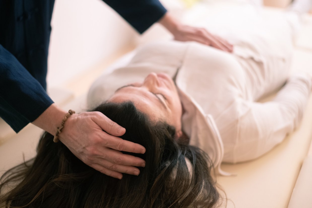 Therapist Man Doing Holistic Therapy Reiki To A Woman. Energy Treatment With The Heat Of Palm Hands